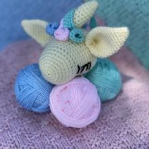 Unicorn Cuddle Buddie in pastel colors. From Plymouth Yarns for knit or crochet