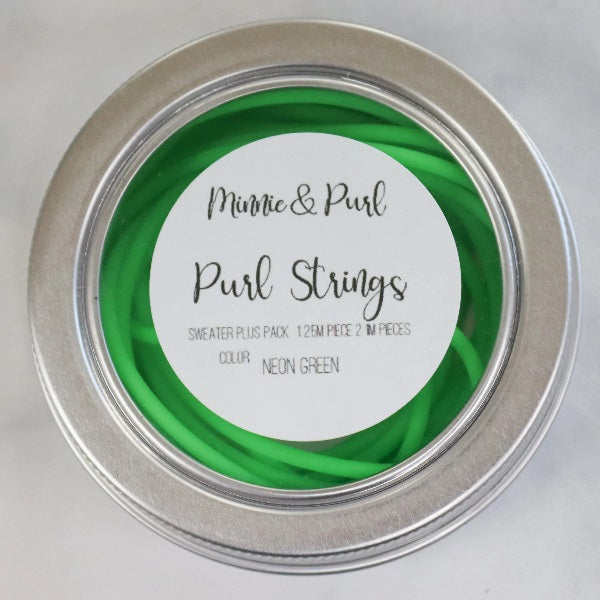 Purl of Strings from Minnie and Purl. The silcone tubing that lets you try on top down sweaters.