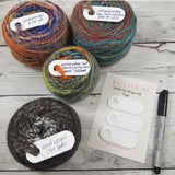 Katrinkles Write On/Wipe Off Tags. Pictured with card of 3, yarn cakes and marker.